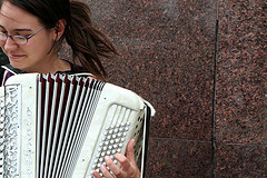 Lady playing the accordion instrument