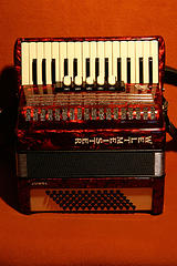 New Red and ivory colored accordion